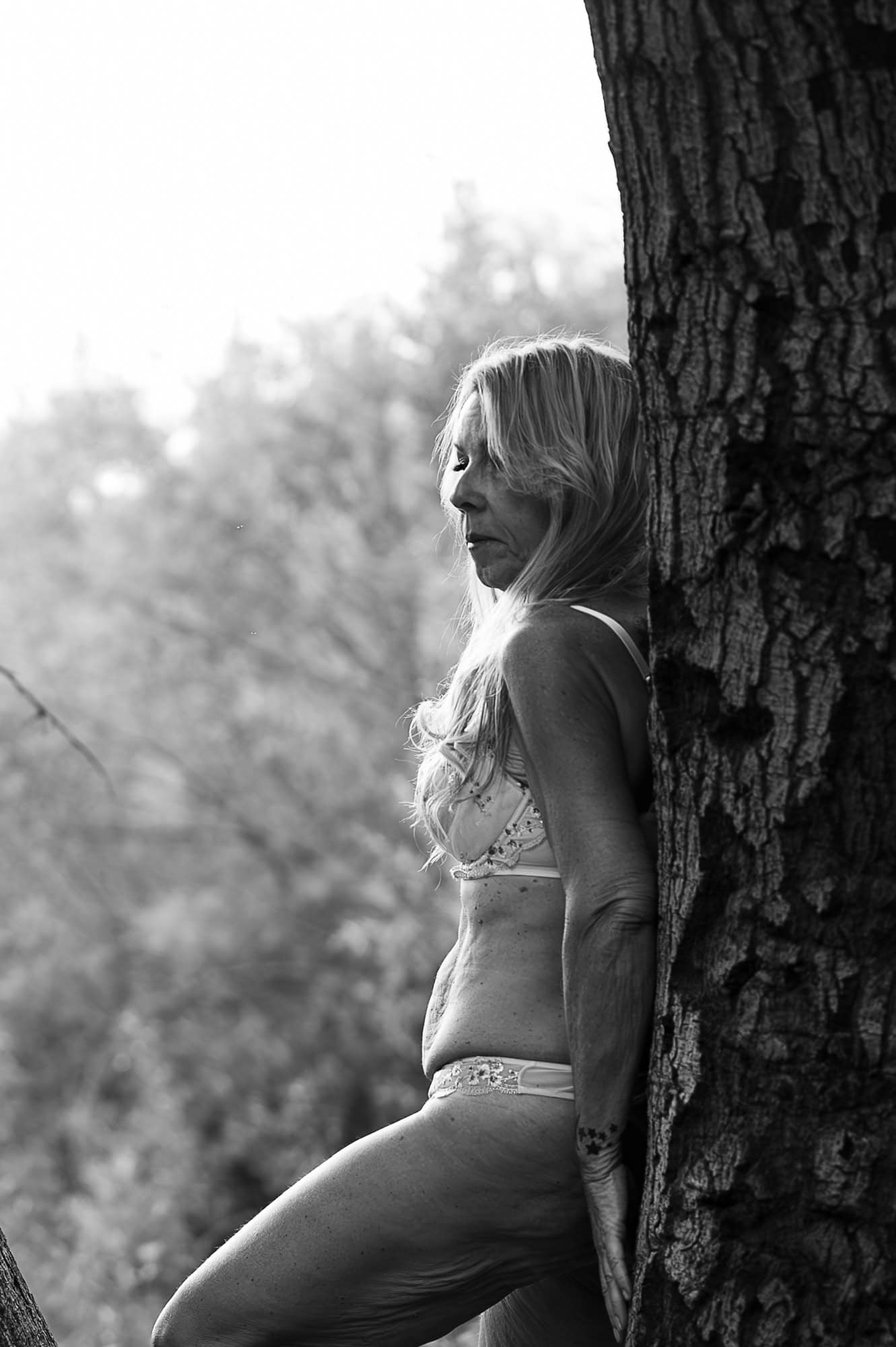 Standing wood outdoor boudoir photograph at Placeritas Canyon in Los Angeles in a cute panty set. 