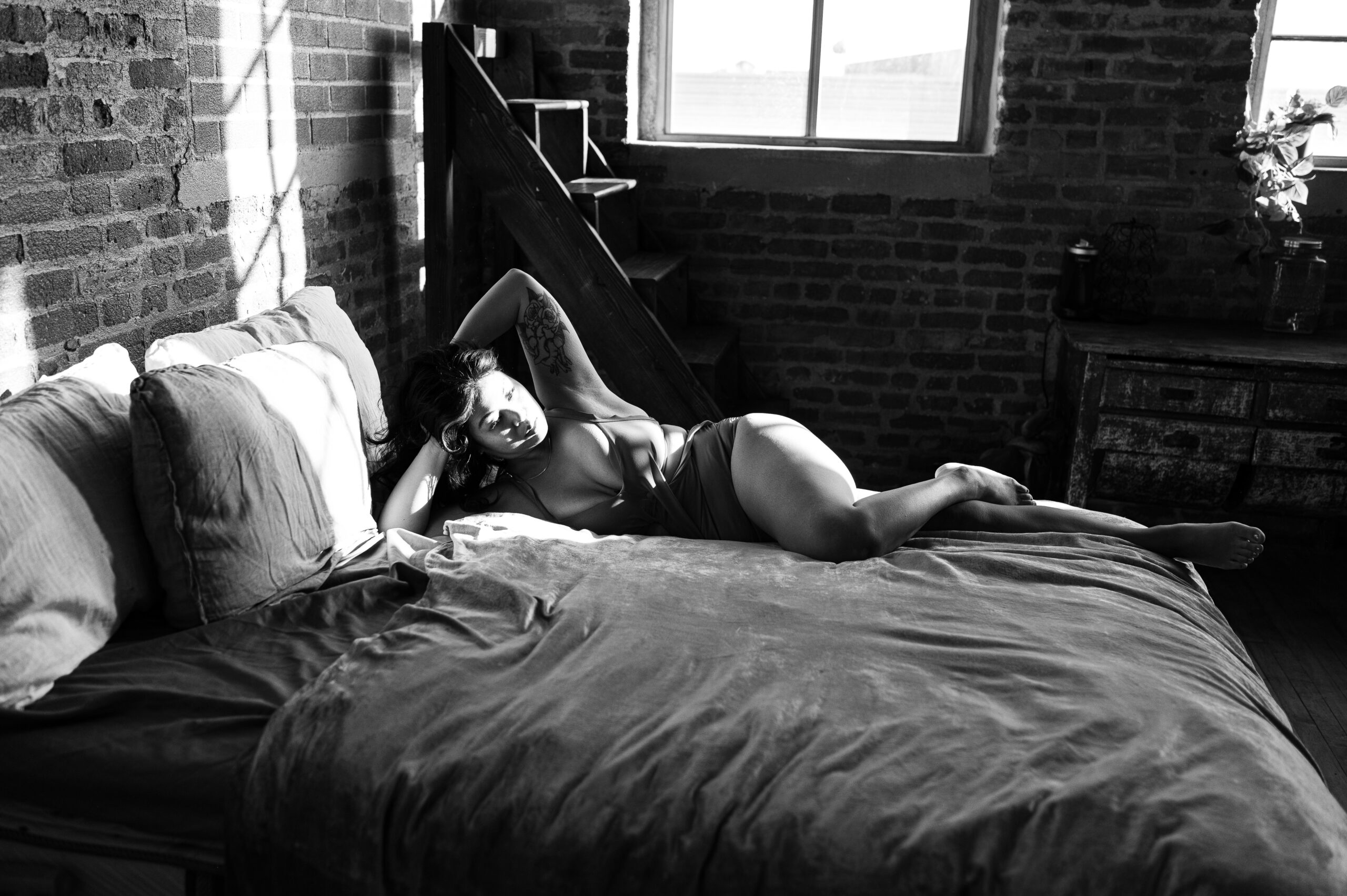 example of a boudoir client wearing a lingerie bodysuit