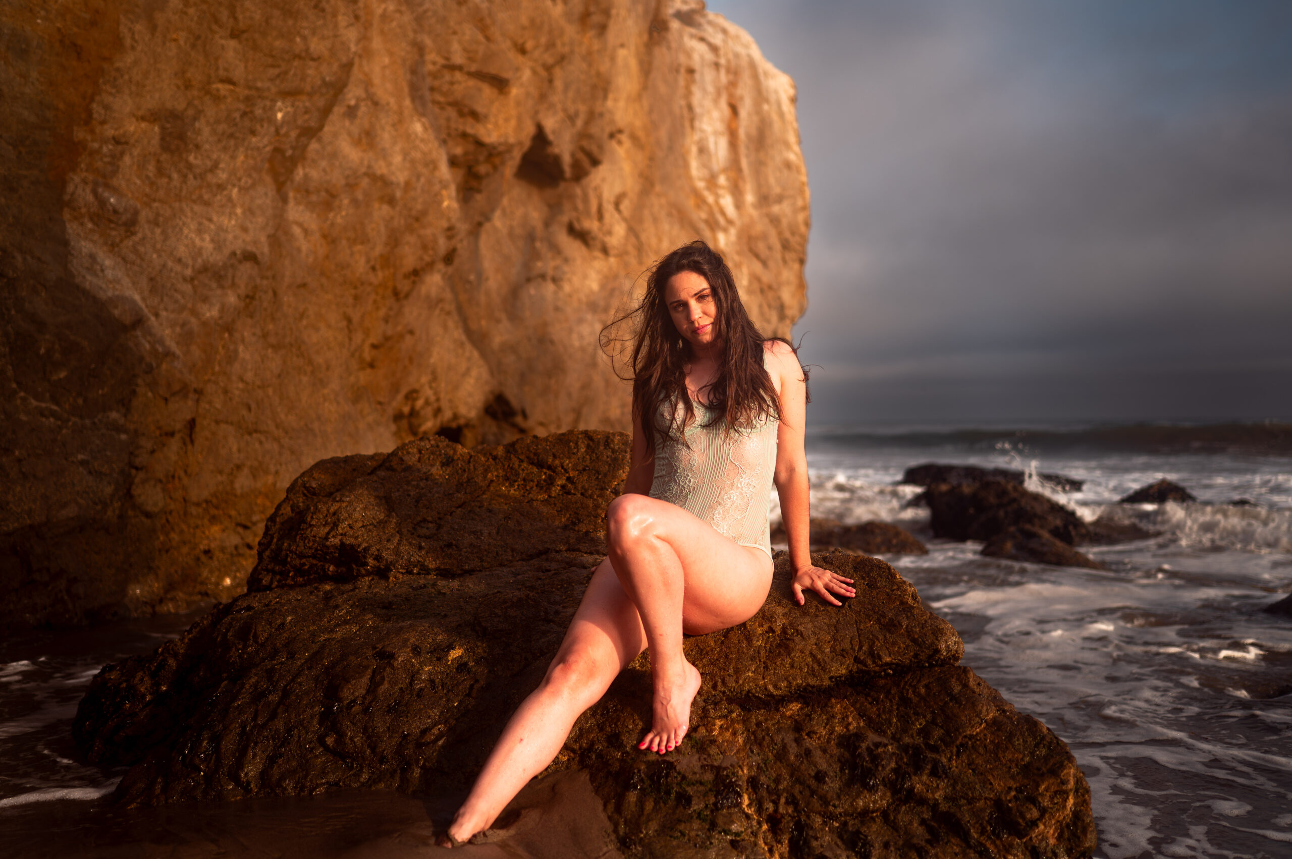 ELI Boudoir Luxury boudoir photography in Los Angeles. This image showcases a beautiful vintage blue bodysuit as an example for the best boudoir lingerie for every skin tone. 